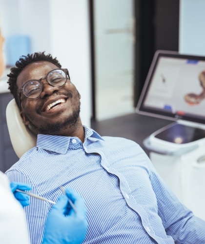 man smiling in dental chair
