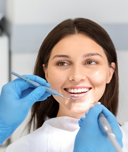 woman in dental chair smiling